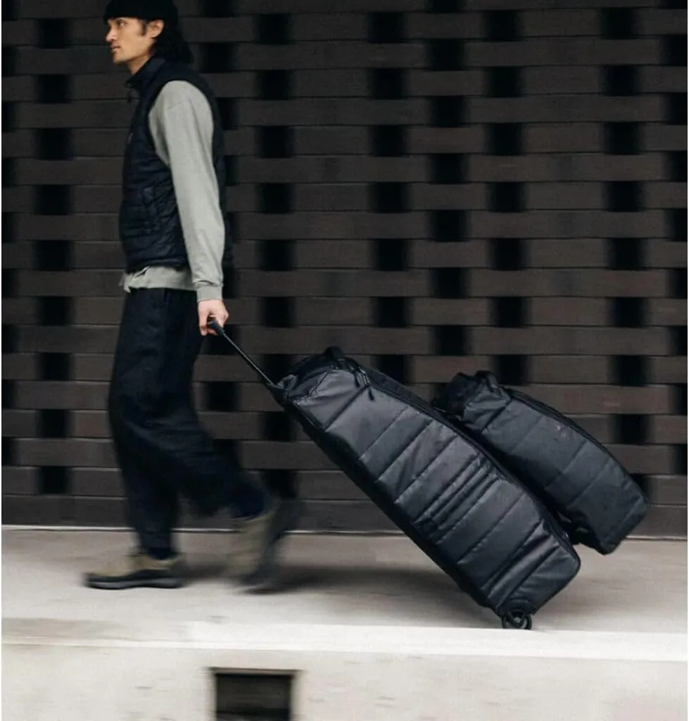 Db Journey The Hugger Roller Duffle Bag - Durable Wheeled Luggage with Handle, Interior Pockets, Hook Up System, 90L - Blackout