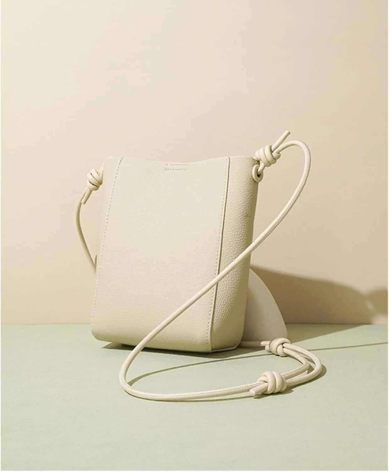 Head layer cowhide bag for women,lightweight and simple tote,bucket crossbody bag, adjustable drawstring shoulder Bag.